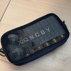 Black Travel Organizer with Gold Bottles